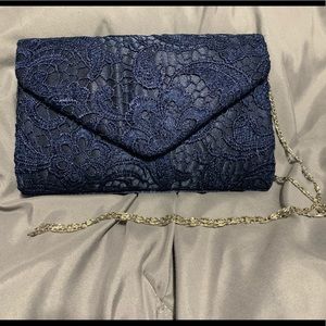 Navy lace clutch with removable strap
